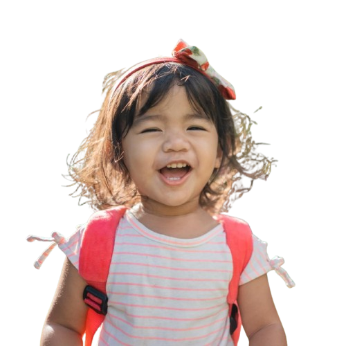 Child with red bag smiling